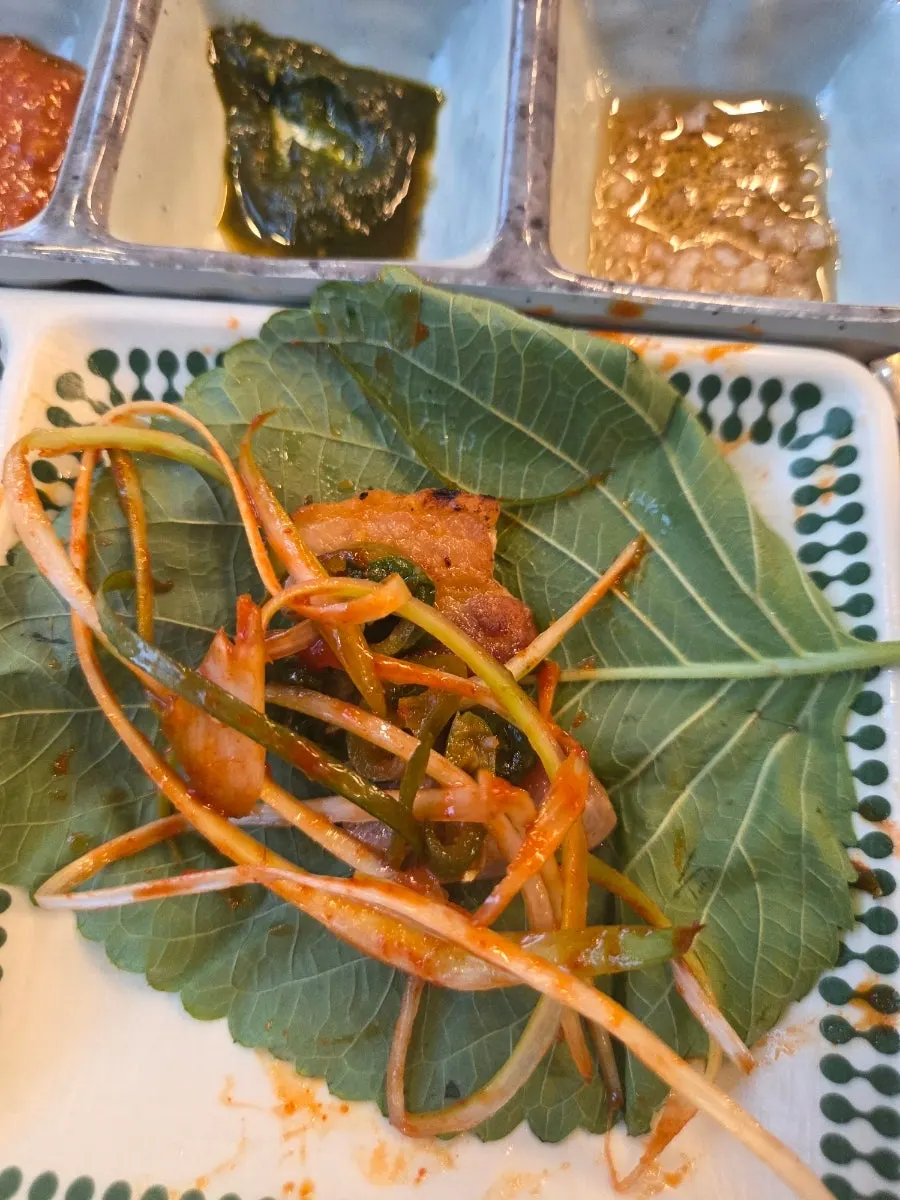 King salt pork belly grilled over charcoal briquettes
