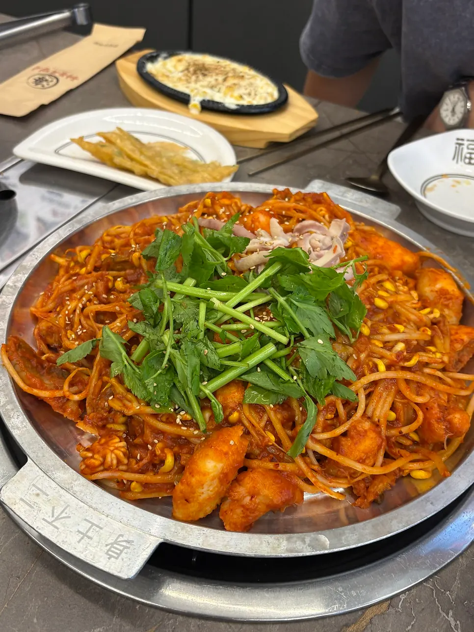 Monkfish stew on the griddle with the set dishes