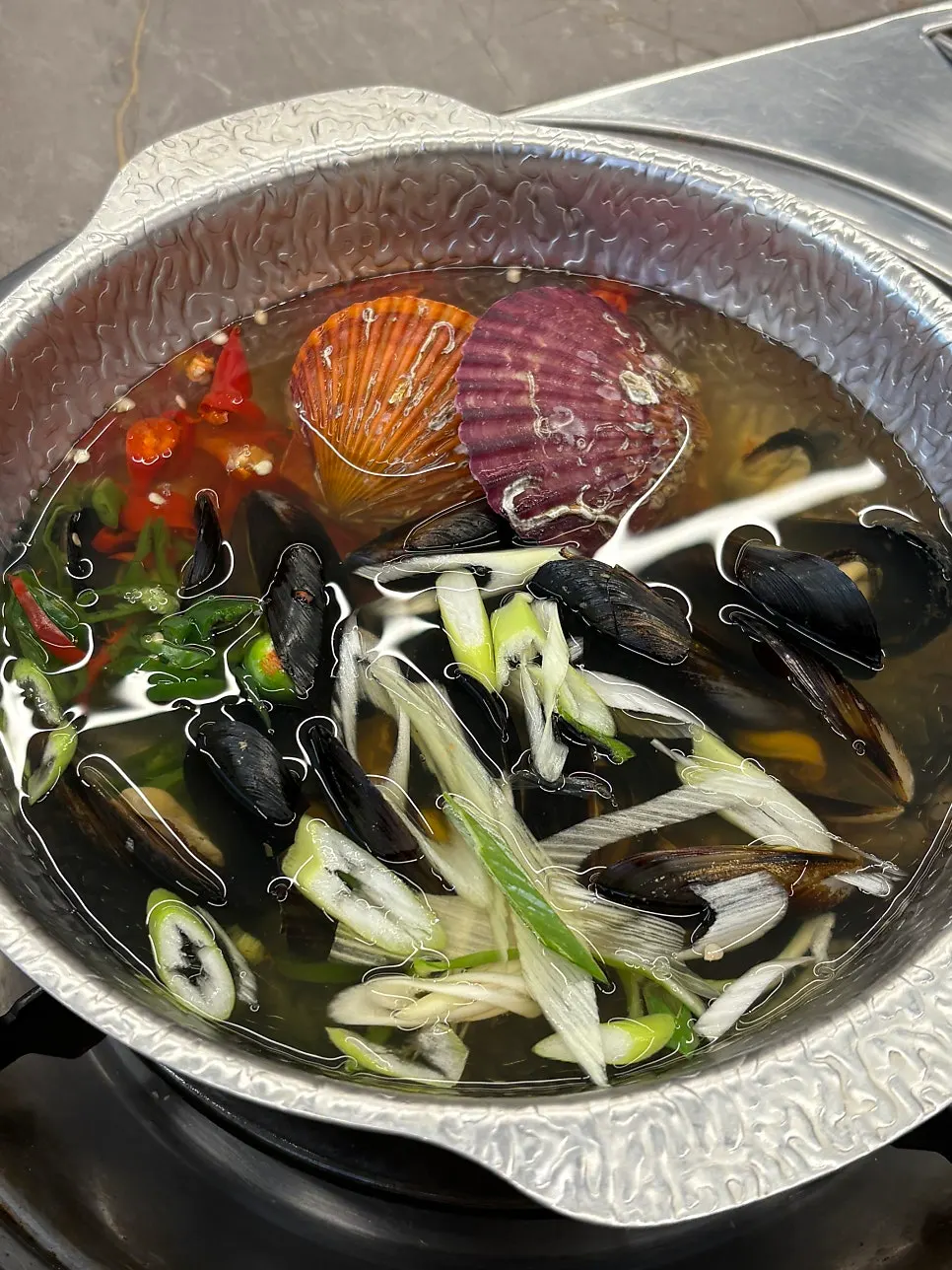 Clam soup served with spicy monkfish stew
