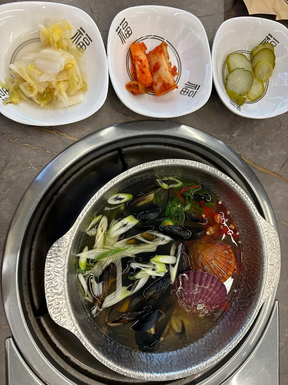 White kimchi, green onion kimchi, and pickled radish wrap sides