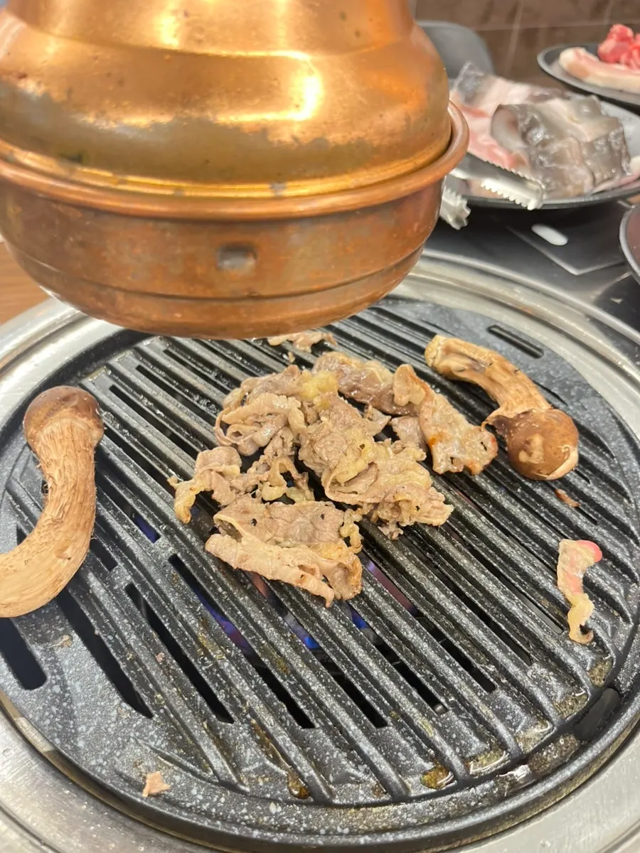 Freshwater eel grilling to a golden brown on the grill