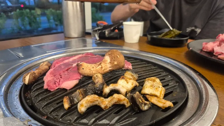 Eel and meat shared by child and adults