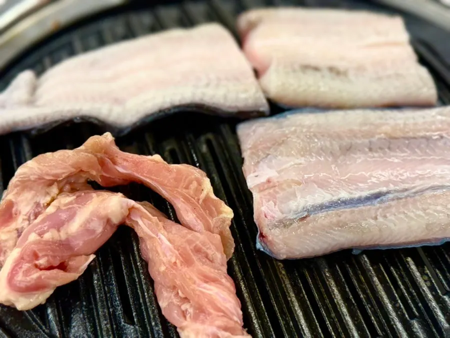 Freshwater eel and meat on the grill