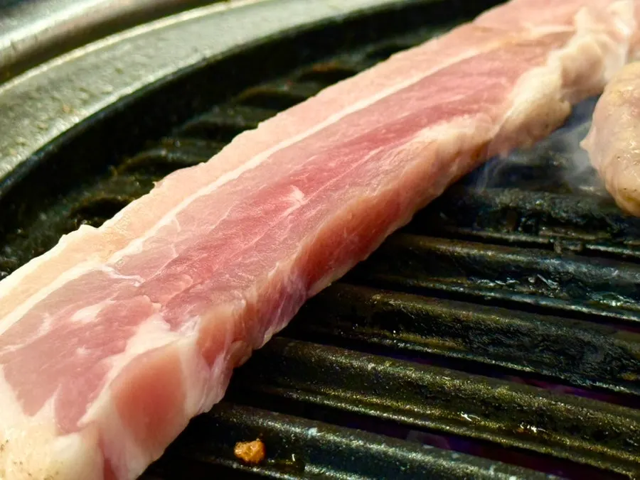 Plate of bright red raw pork