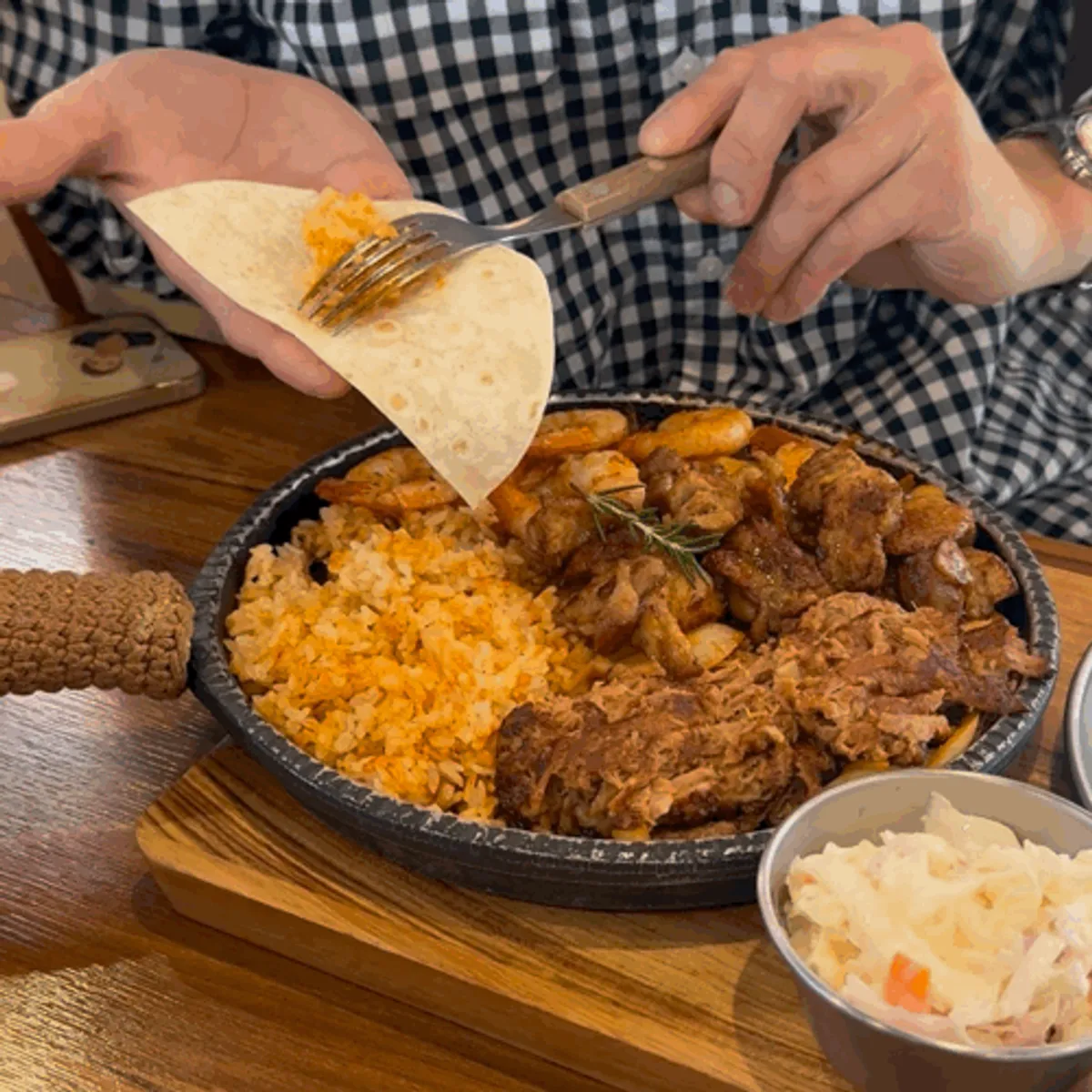 Fajita platter served with tortillas and sauce