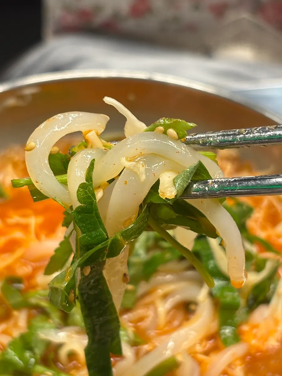 Squid mulhoe with bits of ice floating in the broth