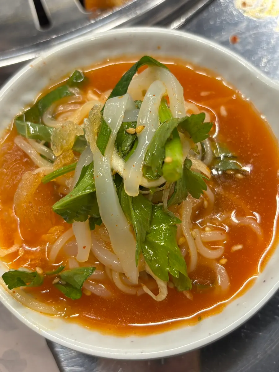 Minari and shredded squid ingredients in the mulhoe