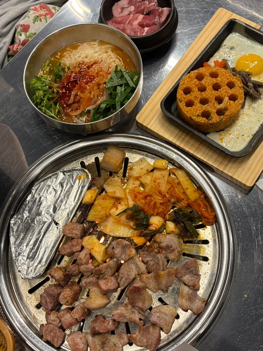 Diced charcoal fried rice served on a shovel-shaped pan