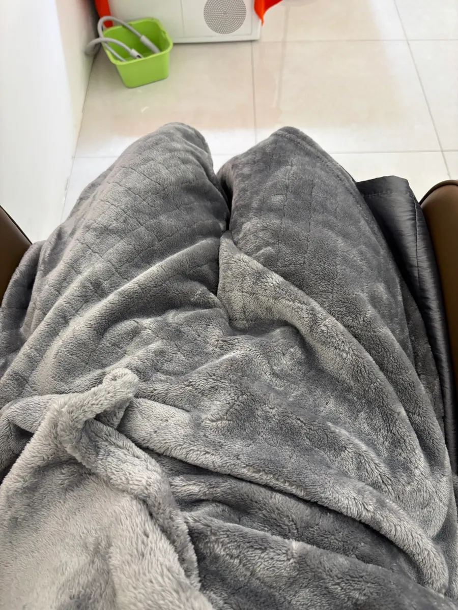 Blanket draped over legs during the treatment