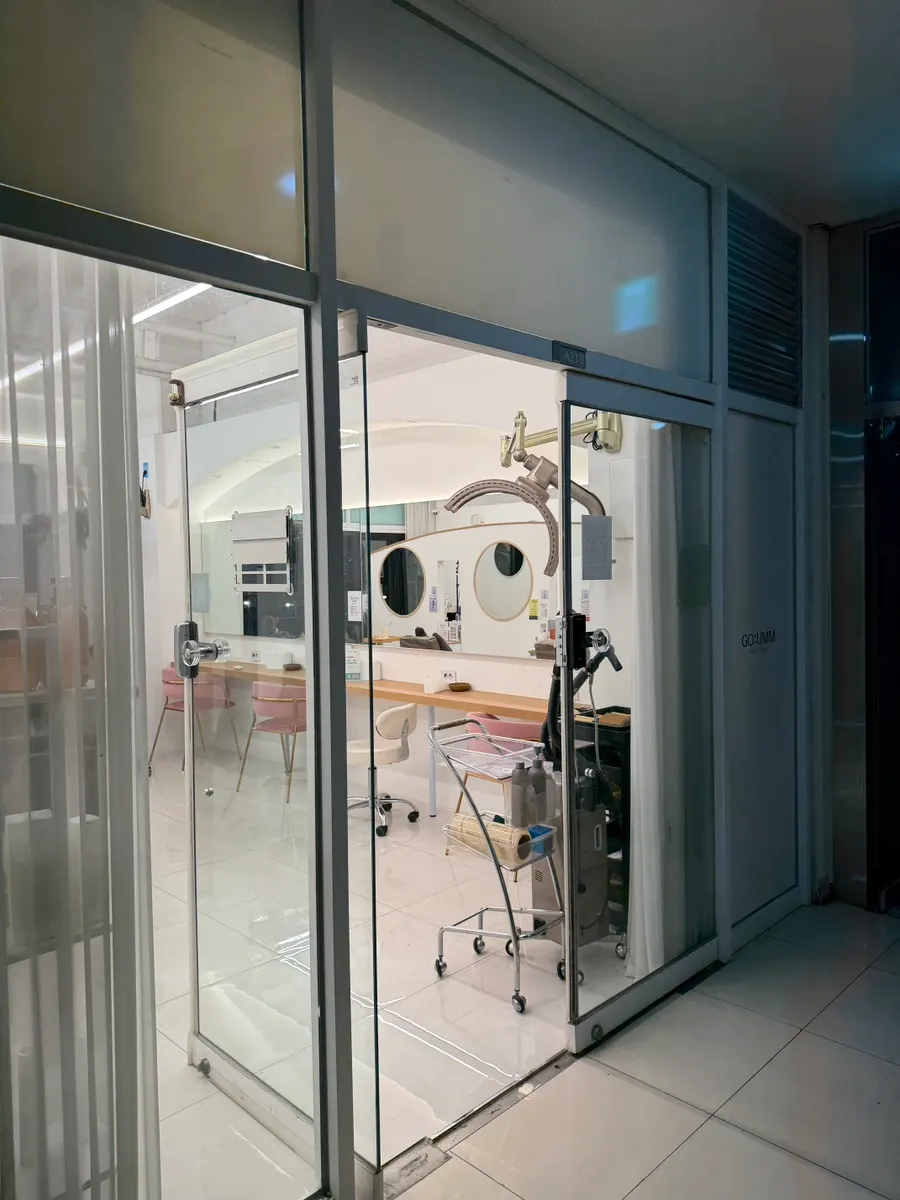 Bright white entrance of the hair salon