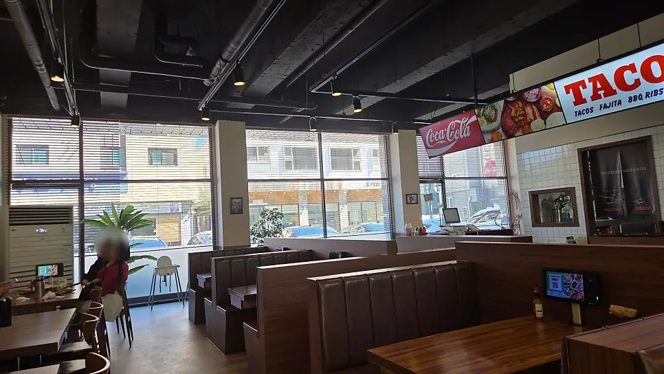 Interior with wood-toned tables