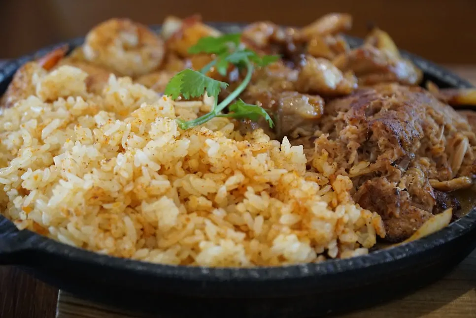 Table with tortillas and fajita ingredients