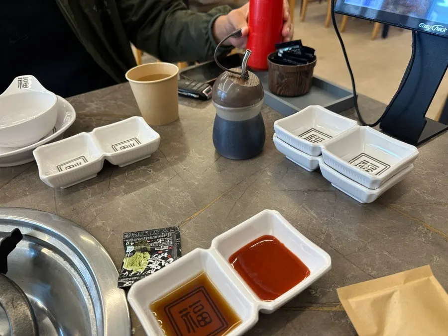 Vinegar-gochujang and soy sauce set on the table