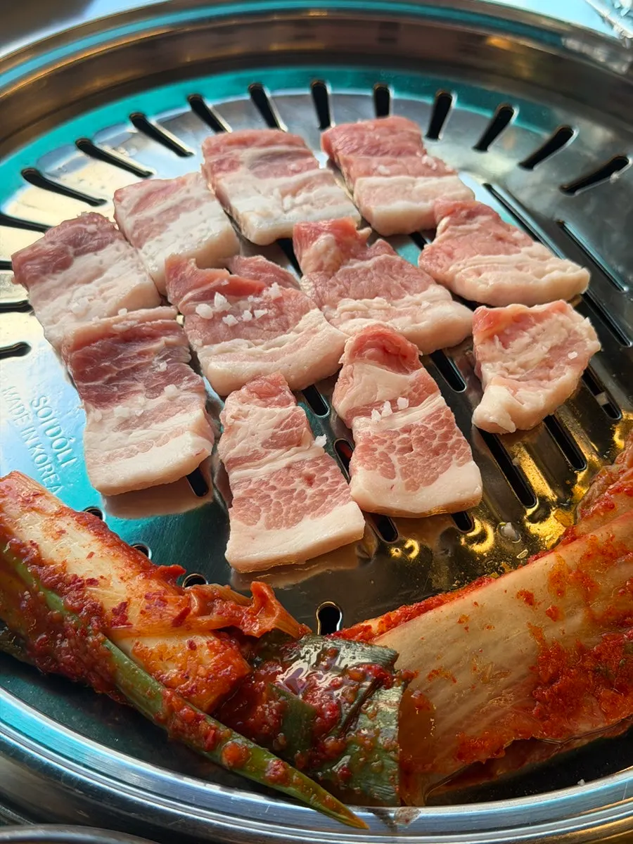 Plate of thick, pink raw pork belly