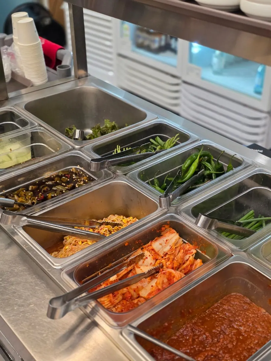 Vegetables and side dishes at the self-service corner