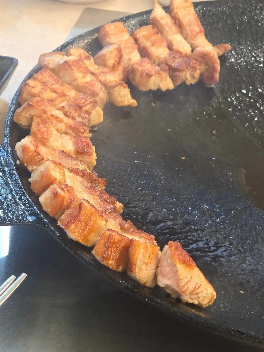 Whole pork belly on the grill