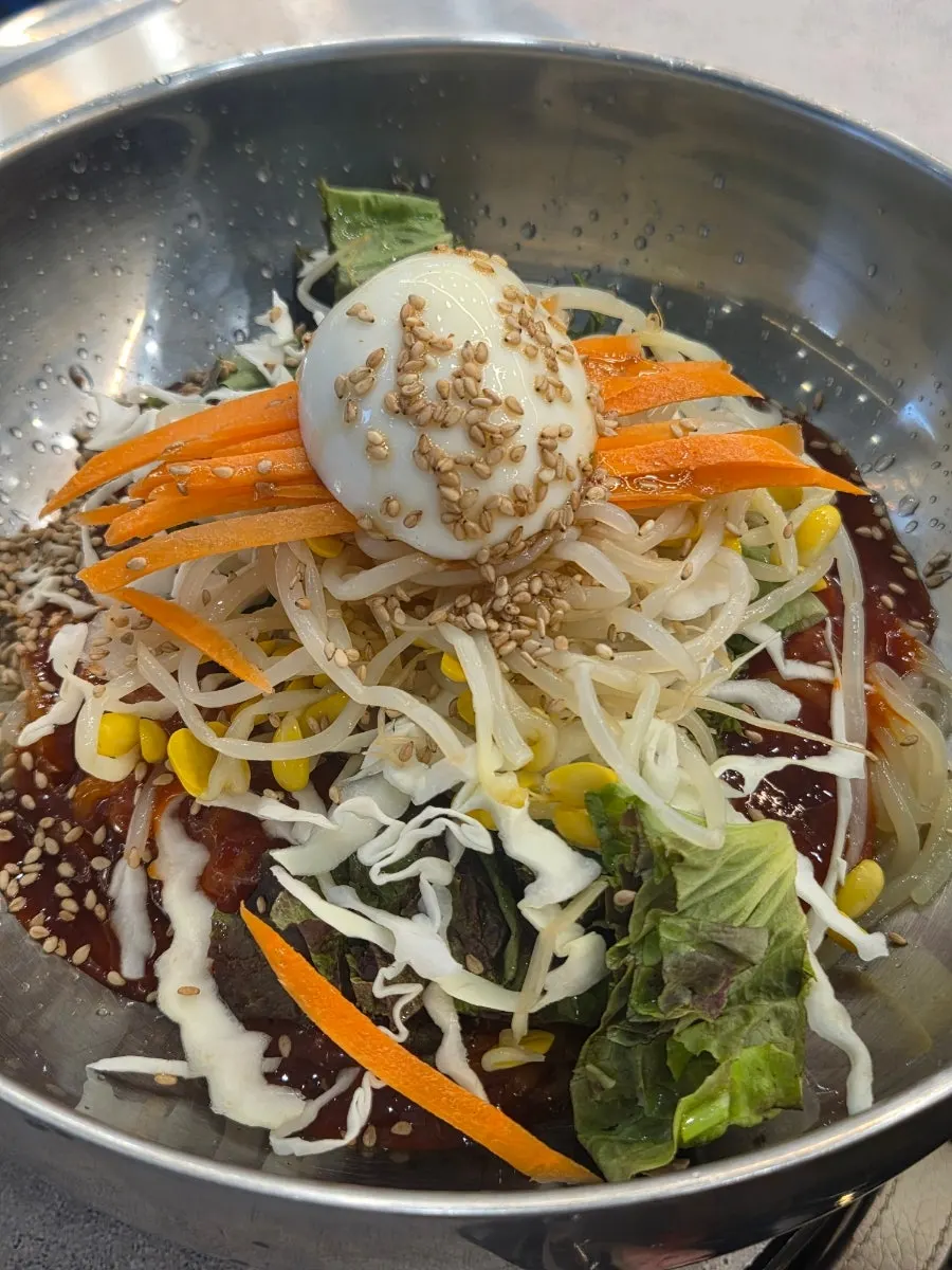 Tangy spicy jjolmyeon ordered as a side