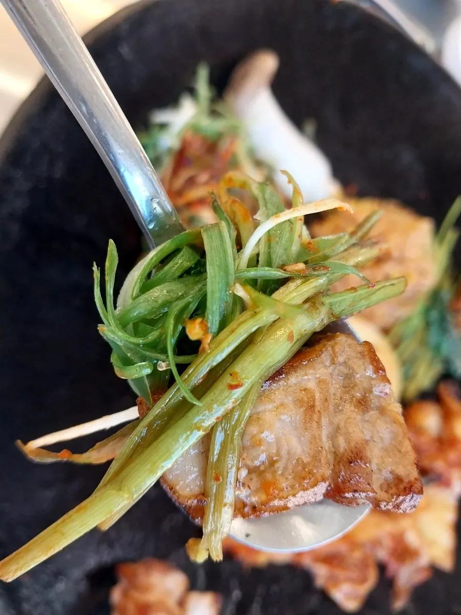 Cross-section of a thickly sliced pork belly piece