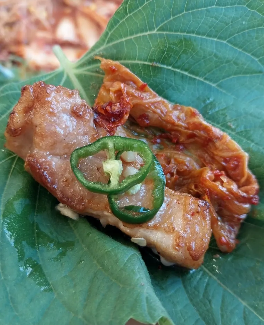 Pork belly wrapped together with minari