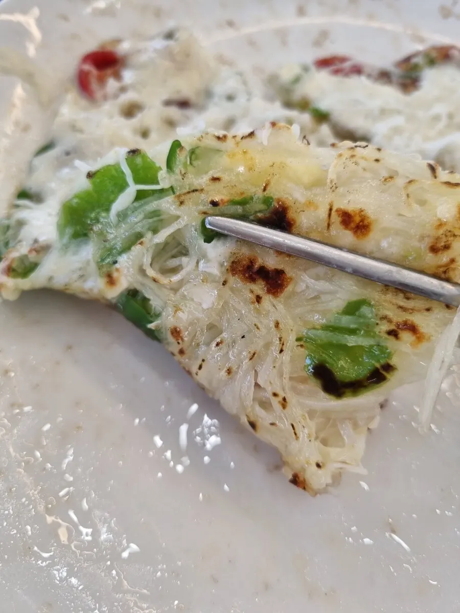 Cross-section of the potato cheese pancake with stretchy cheese