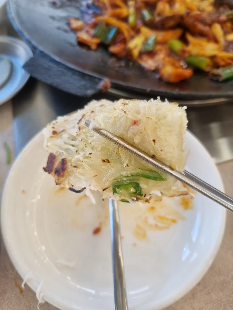 A piece of potato cheese pancake with pepper inside