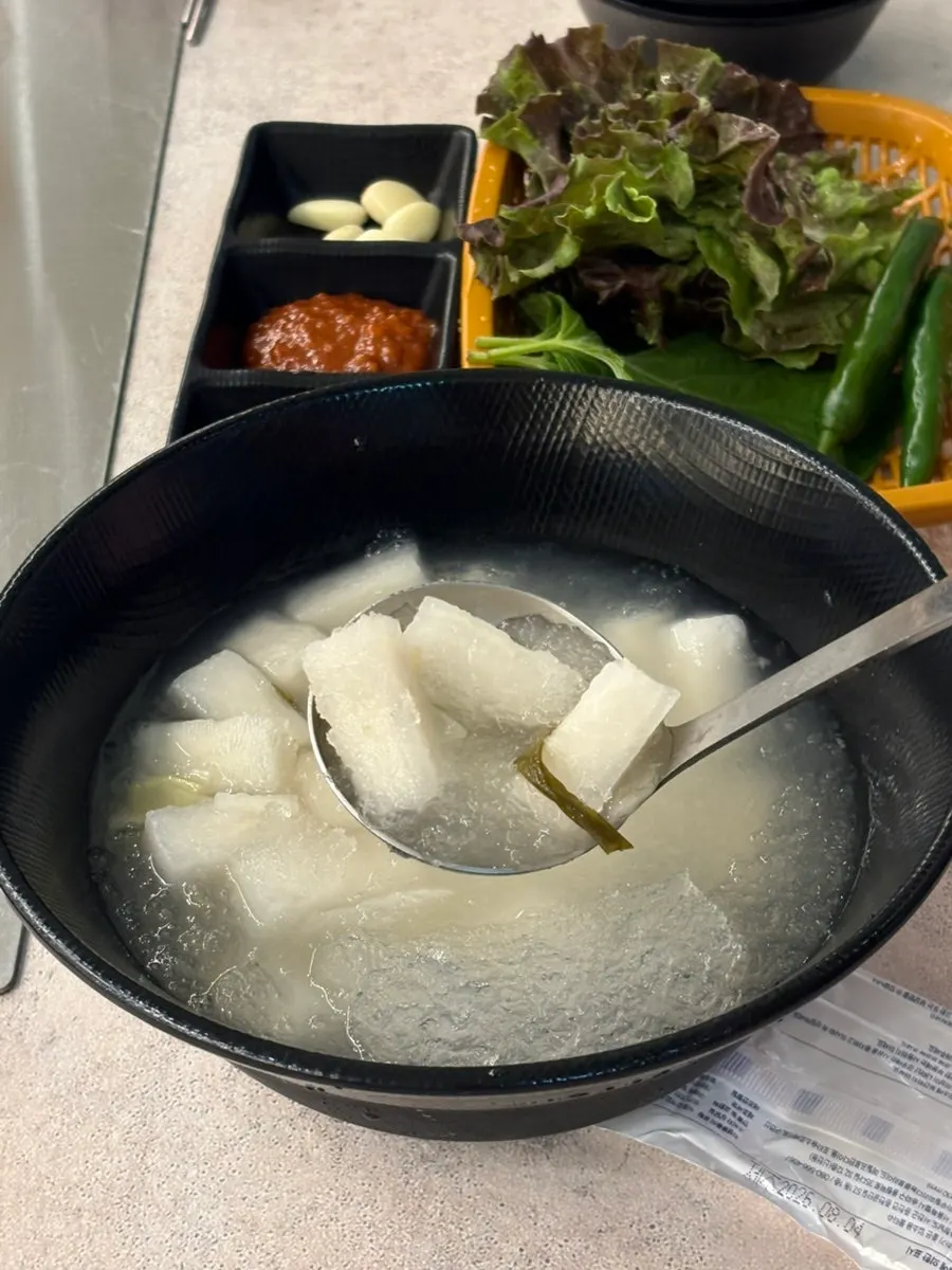 Ingredients laid out: kimchi, bean sprouts, onion, mushroom, minari