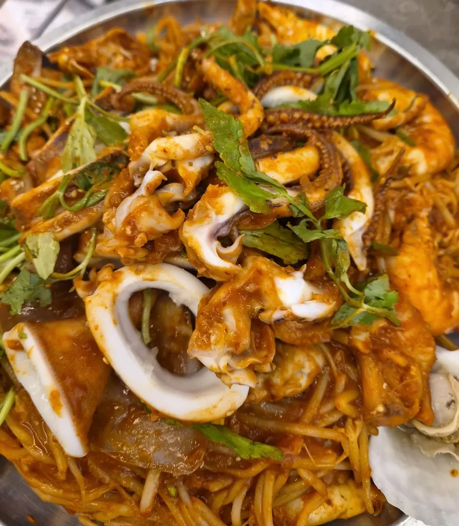 Plate of scooped-out bean sprouts and seafood
