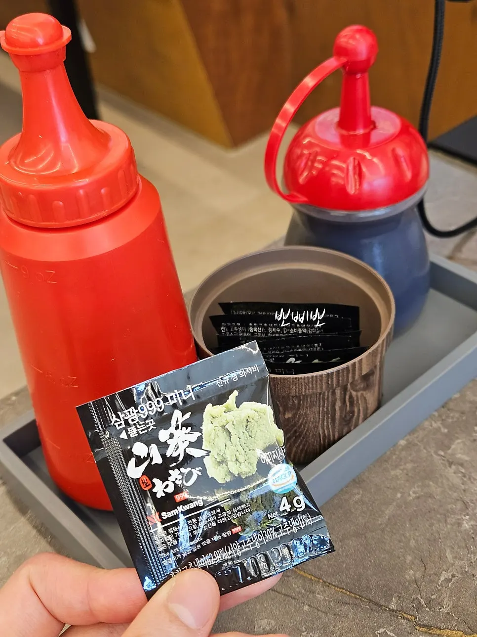 Wasabi, soy sauce, and chogochujang set out on the table