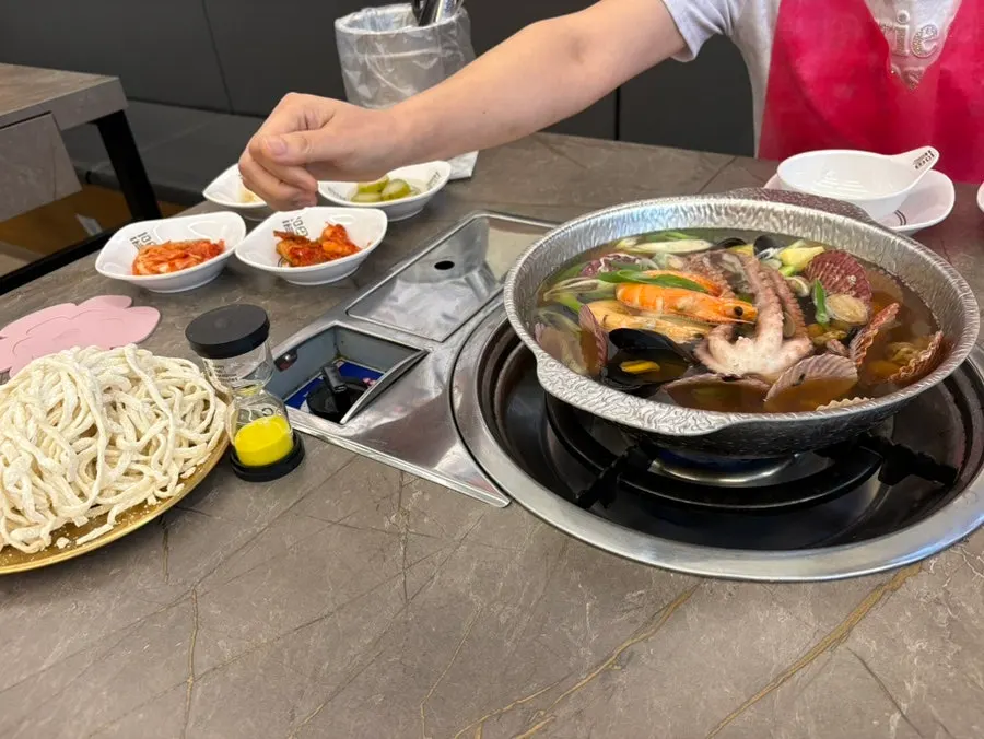 Self-service bar and side dishes beside the kitchen