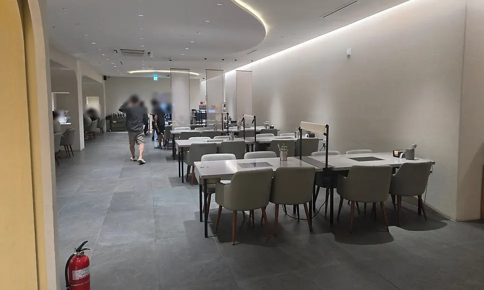 Clean white-toned shabu-shabu restaurant interior