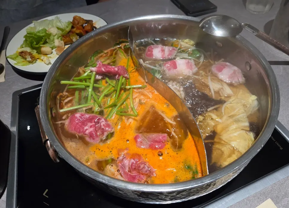 Vegetables and meat in bubbling broth