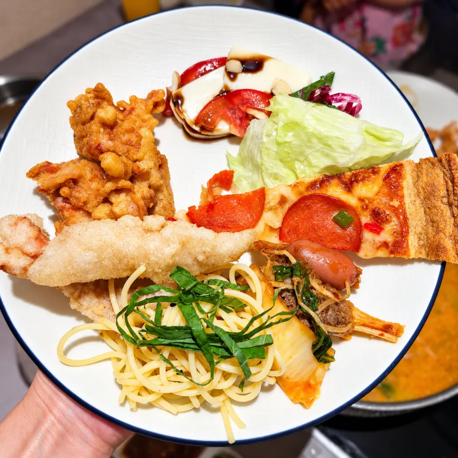 Plate filled with salad and fried food