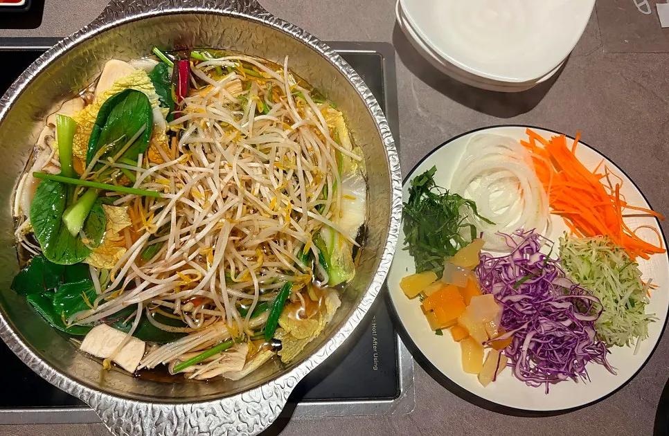 Shabu-shabu pot simmering with vegetables