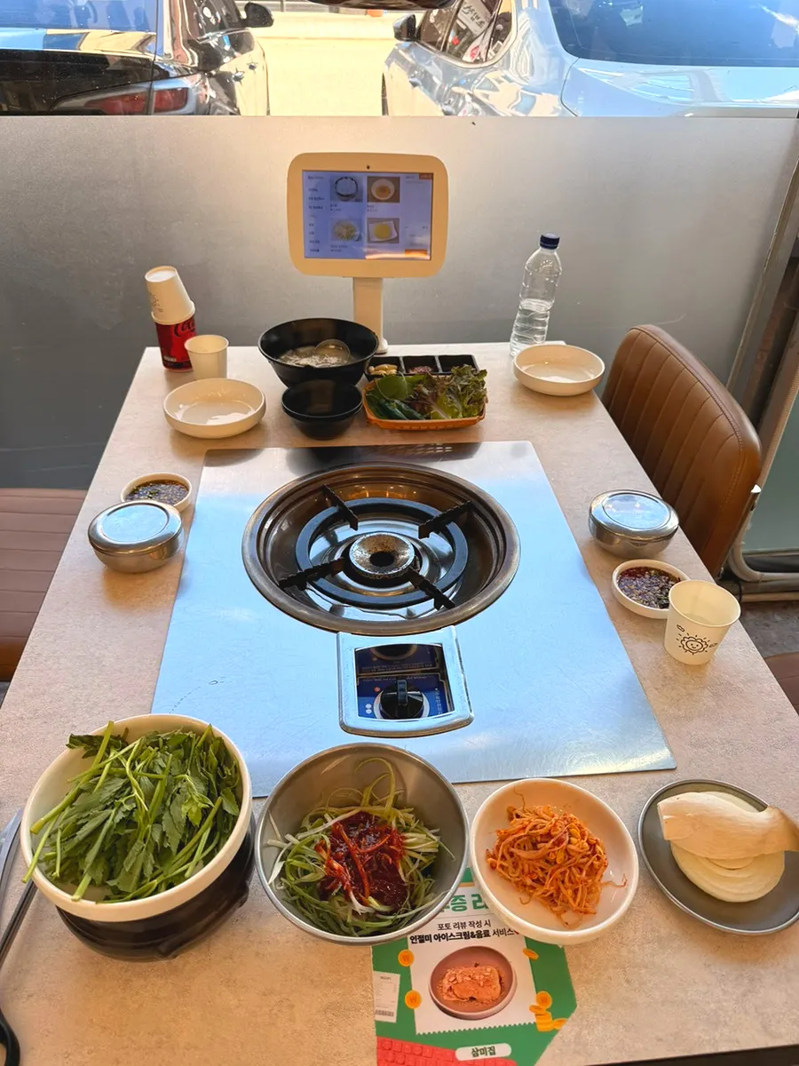 Complimentary sides with minari and dongchimi broth