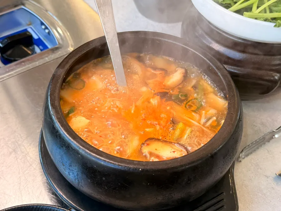 Soybean paste stew served in an earthenware pot