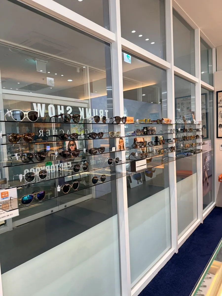 Brand glasses on display, including Tom Ford and Moscot