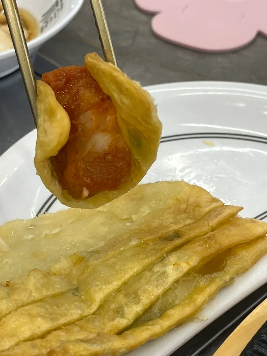 Agu-jjim wrapped in a flat dumpling