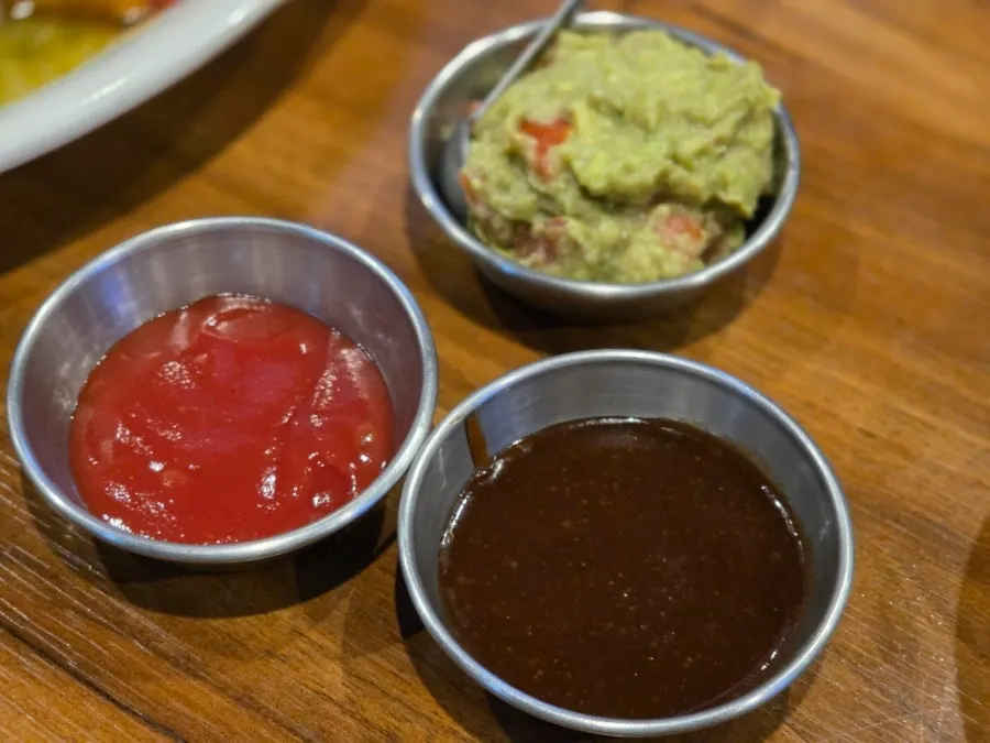 Guacamole, ketchup, and steak sauce