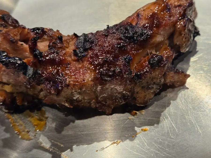 A thick piece of barbecue rib