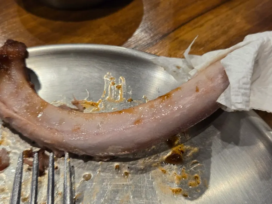 Tender rib meat separating from the bone