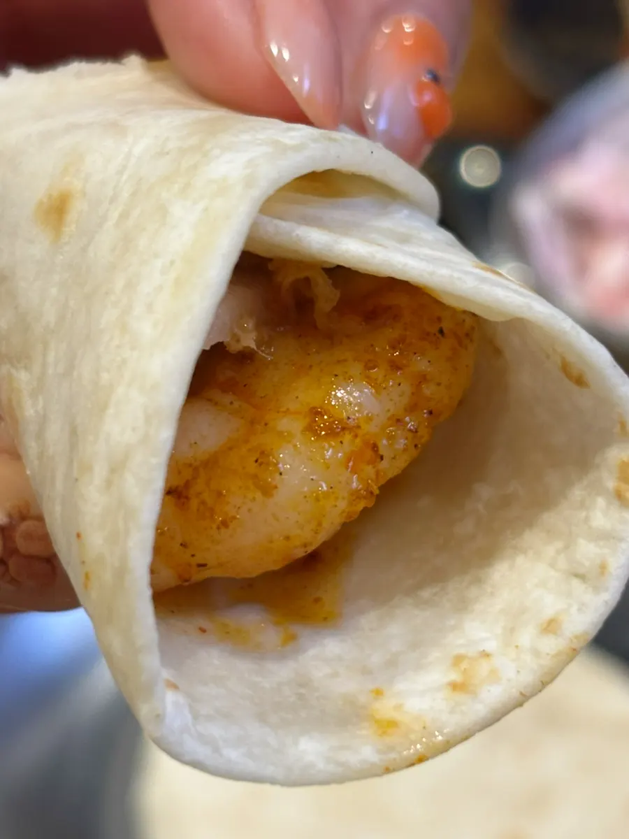 Rolled-up fajita taco ready to eat