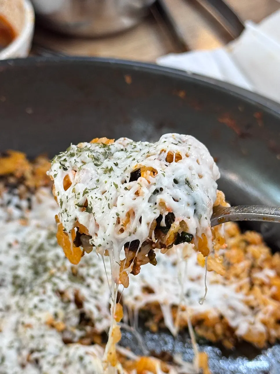 Cheese fried rice topped generously with snowy cheese