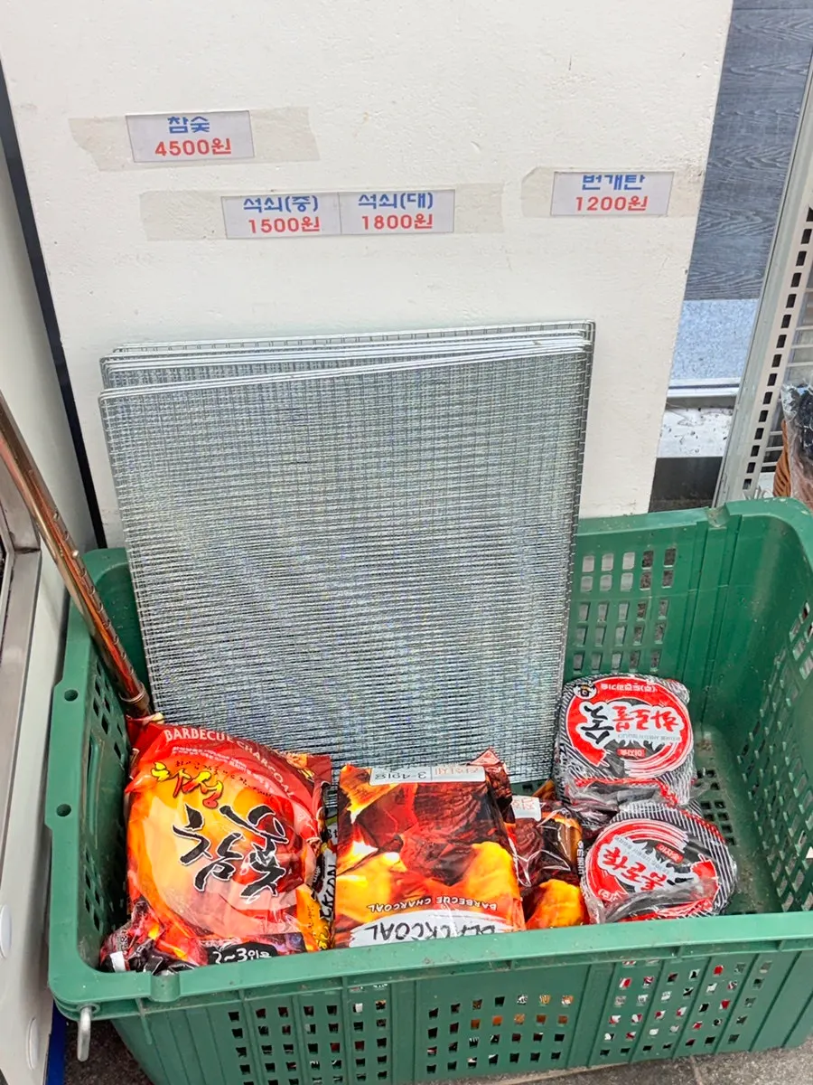 Section selling charcoal and grill grates for barbecue