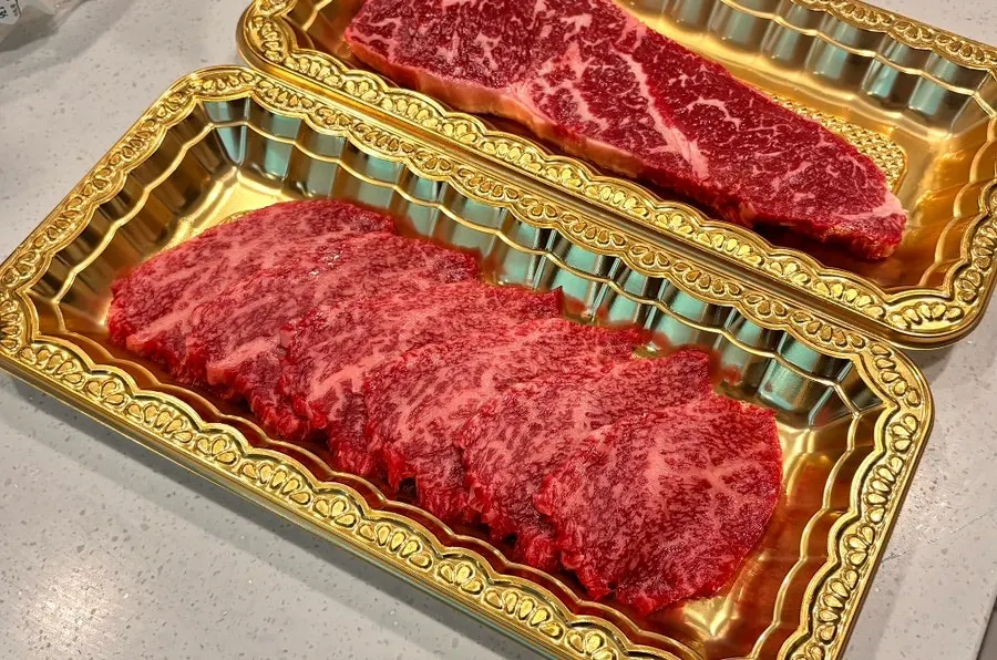 Korean beef striploin and flank packaged in gold containers