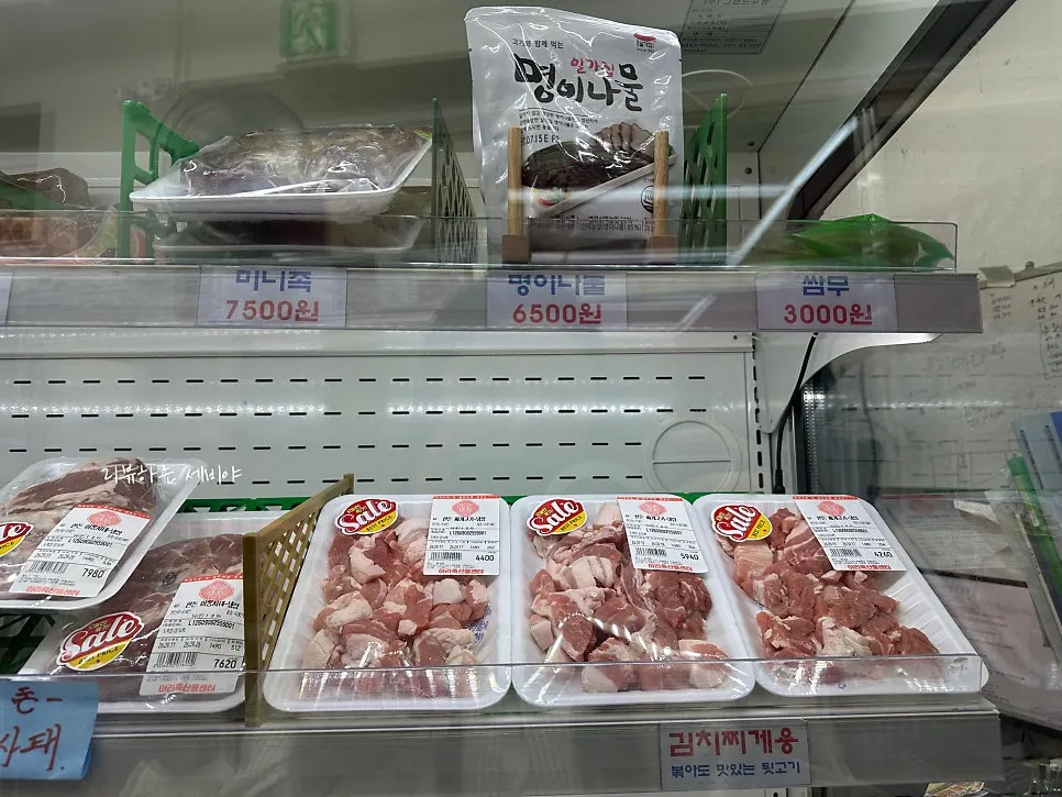 Side dishes on display, including myeong-i namul and ssammu