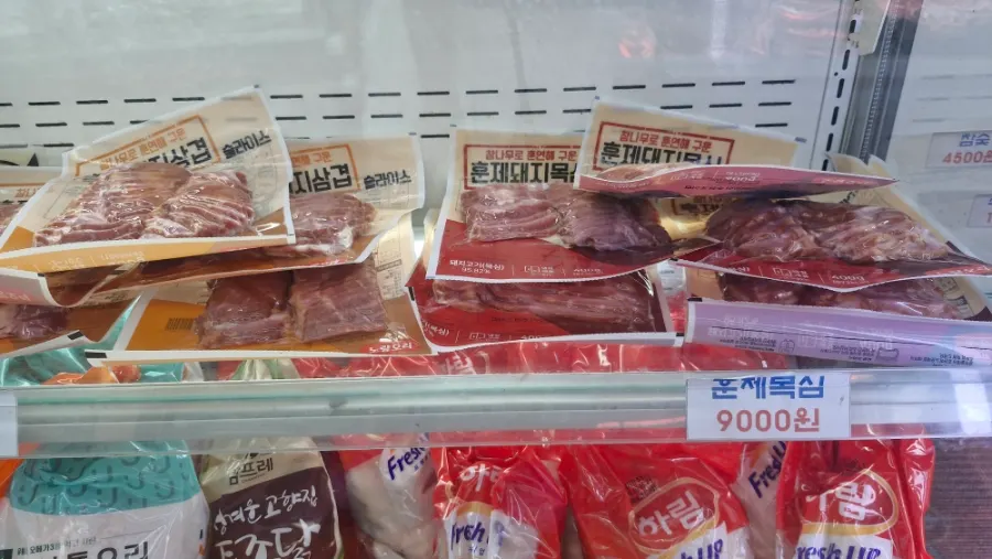 Various meat products on the butcher shop shelves