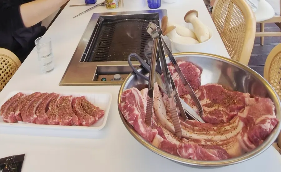 Raw meat sprinkled with seasoning, ready to prep