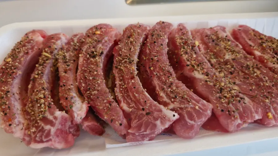 Pork back ribs generously covered in seasoning
