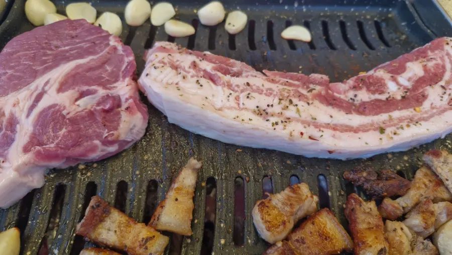 Cross-section of grilled pork neck with garlic