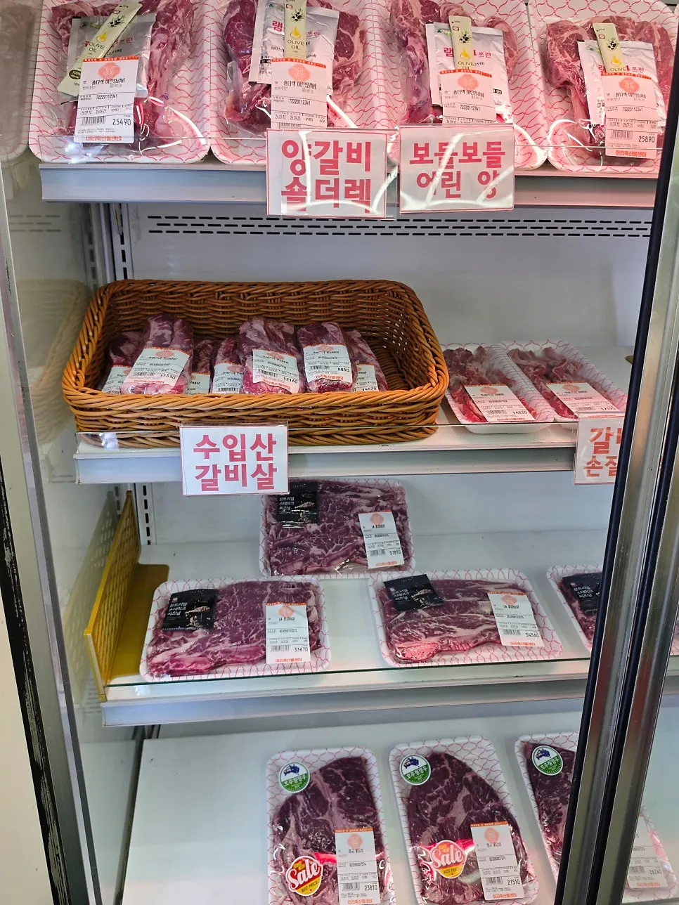 Display case with lamb shoulder rack and Wagyu flower ribeye